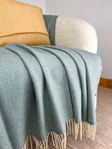 Merino Lambswool Throw - Topaz Herringbone - McNutt of Donegal - on chair